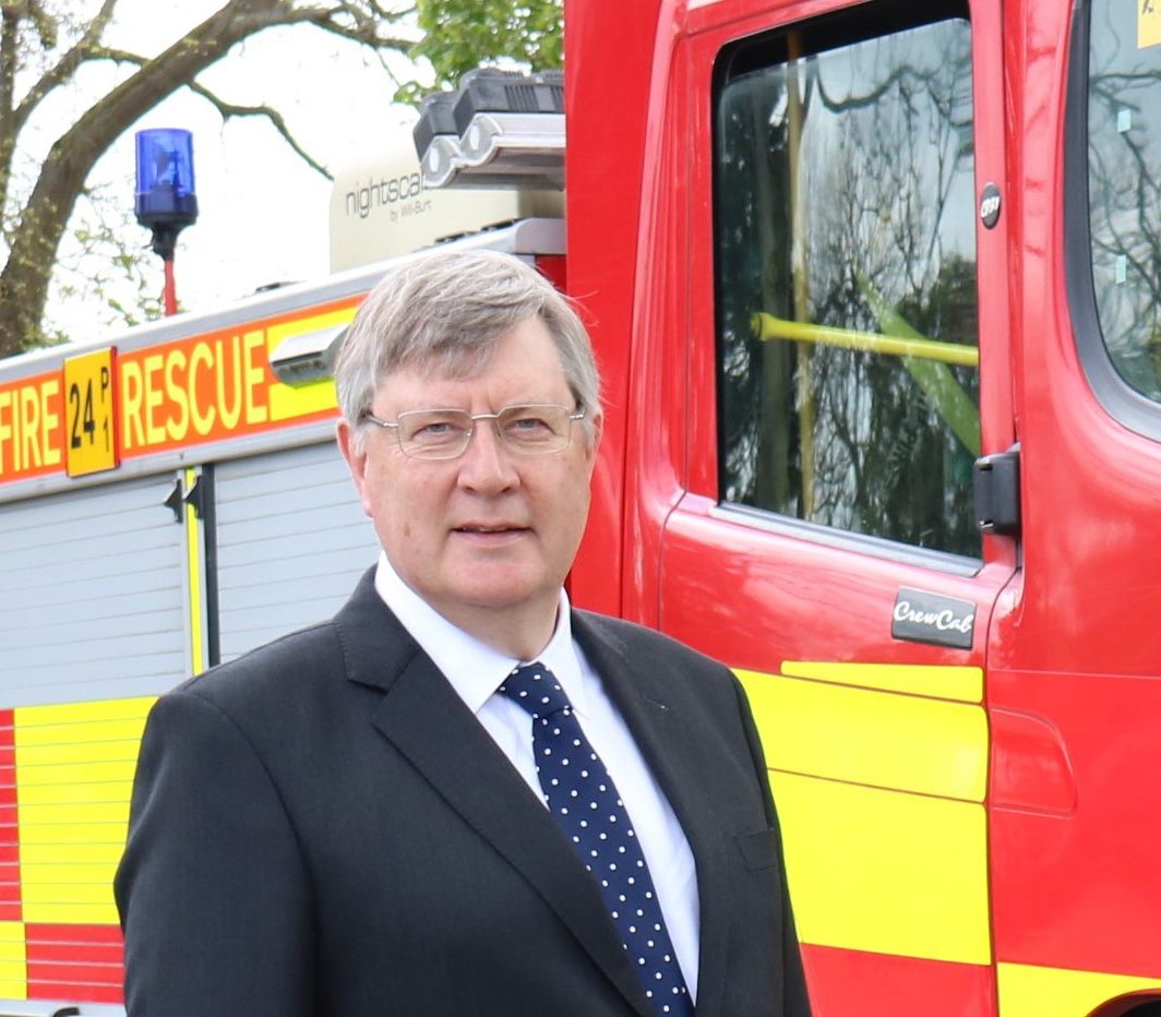 Roger Hirst stood in front of fire engine