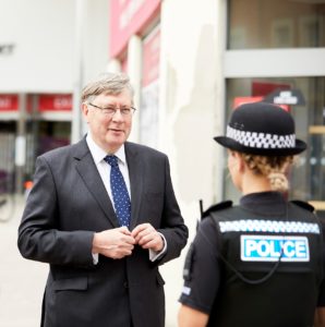PFCC Roger Hirst talking to a police officer in Chelmsford city centre.