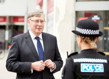 PFCC Roger Hirst talking to a police officer in Chelmsford city centre.